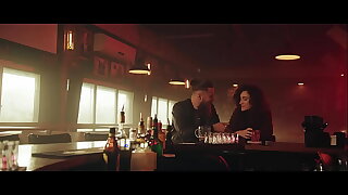 bloke and woman kissing sitting in bar with left-hand lights